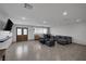 Spacious living room featuring wood flooring, recessed lighting, and double doors at 603 Palmhurst Dr, Las Vegas, NV 89145