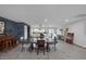 Expansive open living space with dining table connecting to the modern kitchen at 603 Palmhurst Dr, Las Vegas, NV 89145