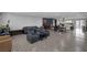 Expansive open-concept living space with a modern kitchen and comfortable seating area at 603 Palmhurst Dr, Las Vegas, NV 89145