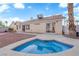 Backyard with a refreshing blue splash pool and rock landscaping, providing a private outdoor oasis at 6231 Curlew Dr, Las Vegas, NV 89122