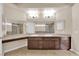 Bathroom with double sinks, neutral walls, and wooden cabinets at 6231 Curlew Dr, Las Vegas, NV 89122