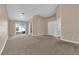 Spacious bedroom with sliding glass doors opening to the backyard, and plush carpeting at 6231 Curlew Dr, Las Vegas, NV 89122