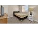 Cozy bedroom with neutral tones, a window for natural light, and simple furnishings at 6231 Curlew Dr, Las Vegas, NV 89122