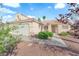 Single story home featuring desert landscaping, a two car garage, and a light colored exterior at 6231 Curlew Dr, Las Vegas, NV 89122