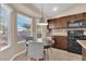 Inviting kitchen featuring natural light, modern appliances and a cozy breakfast area at 6231 Curlew Dr, Las Vegas, NV 89122