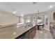 Eat-in kitchen featuring stainless steel appliances, tile floors, and granite countertops at 6231 Curlew Dr, Las Vegas, NV 89122