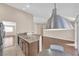 Bright kitchen featuring stainless steel appliances, a granite countertop, and stylish lighting at 6231 Curlew Dr, Las Vegas, NV 89122