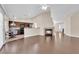 Spacious living room with an open layout and hardwood flooring, seamlessly flowing into the kitchen at 6231 Curlew Dr, Las Vegas, NV 89122