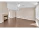 Open living room featuring a fireplace and hardwood floors at 6231 Curlew Dr, Las Vegas, NV 89122