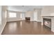 Open-concept living room with wood floors, fireplace, and a view of the front entrance at 6231 Curlew Dr, Las Vegas, NV 89122