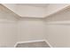 Walk-in closet with wood clothing racks, and neutral color walls at 6231 Curlew Dr, Las Vegas, NV 89122