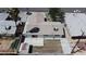 An aerial view shows the home and surrounding area, including the back patio and unlandscaped backyard at 6305 Fairwood Ave, Las Vegas, NV 89107