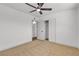 Bedroom featuring neutral carpet, a modern ceiling fan, and a closet with sliding doors at 6305 Fairwood Ave, Las Vegas, NV 89107