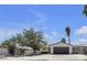Charming single-story home featuring an attached garage and a well-maintained front yard with mature trees at 6305 Fairwood Ave, Las Vegas, NV 89107