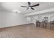 Open floor plan with modern kitchen featuring an island with barstool seating at 6305 Fairwood Ave, Las Vegas, NV 89107