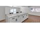 Modern kitchen featuring white cabinets, stainless steel appliances, and a large island with bar seating at 6305 Fairwood Ave, Las Vegas, NV 89107
