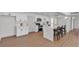 Modern kitchen featuring white cabinets, stainless steel appliances, and a large island with bar seating at 6305 Fairwood Ave, Las Vegas, NV 89107