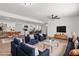 Bright open-concept living room seamlessly connects to a kitchen with modern finishes and stylish decor at 6305 Fairwood Ave, Las Vegas, NV 89107