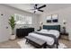 Bright bedroom with large window and decor at 6305 Fairwood Ave, Las Vegas, NV 89107