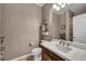 Well-lit bathroom featuring a modern vanity with sleek countertops and stylish fixtures, offering a clean and functional space at 6423 Grayback Dr, North Las Vegas, NV 89084