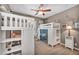 Bedroom with white bunk beds, decor, and shelves at 6423 Grayback Dr, North Las Vegas, NV 89084