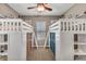 Shared bedroom featuring two sets of white bunk beds and carpet at 6423 Grayback Dr, North Las Vegas, NV 89084