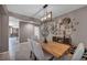 Elegant dining room with stylish light fixture and decorative wall art at 6423 Grayback Dr, North Las Vegas, NV 89084