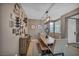 Inviting dining room featuring a rustic wood table and stylish decor at 6423 Grayback Dr, North Las Vegas, NV 89084