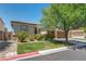 Charming single-story home featuring a well-kept lawn, desert landscaping, and a convenient two-car garage at 6423 Grayback Dr, North Las Vegas, NV 89084