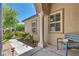 Inviting front porch with decorative column, walkway, and desert landscaping at 6423 Grayback Dr, North Las Vegas, NV 89084