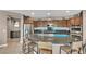 Lovely kitchen featuring granite countertops, stainless steel appliances, and a breakfast bar at 6423 Grayback Dr, North Las Vegas, NV 89084