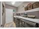 Functional laundry room equipped with modern appliances, ample counter space, and organized storage solutions at 6423 Grayback Dr, North Las Vegas, NV 89084