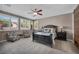 Bright main bedroom with shutters, ceiling fan, and ample natural light at 6423 Grayback Dr, North Las Vegas, NV 89084