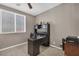 Cozy home office with a large desk, ample storage, and natural light at 6423 Grayback Dr, North Las Vegas, NV 89084