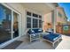 A covered patio with comfortable outdoor seating and ample natural light at 6423 Grayback Dr, North Las Vegas, NV 89084