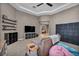 Cozy playroom with a large TV, shelves, and comfortable armchair at 6423 Grayback Dr, North Las Vegas, NV 89084