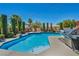 Resort-style pool and spa area with a built-in grill and outdoor seating at 6423 Grayback Dr, North Las Vegas, NV 89084
