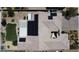 Overhead view of home featuring solar panels and backyard with covered patio in a desert landscape neighborhood at 7072 Arabian Ridge St, Las Vegas, NV 89131