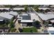Aerial view showcasing a home with a lush backyard, patio, and solar panels in a well-maintained neighborhood at 7072 Arabian Ridge St, Las Vegas, NV 89131