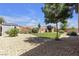Large backyard with low-maintenance desert landscaping and a storage shed at 7072 Arabian Ridge St, Las Vegas, NV 89131