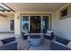 Cozy outdoor patio with comfortable seating around a modern fire pit at 7072 Arabian Ridge St, Las Vegas, NV 89131