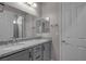 Bathroom featuring dual sinks, granite countertops, and contemporary fixtures at 7072 Arabian Ridge St, Las Vegas, NV 89131