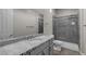 Bathroom with an undermount sink, a full mirror, and a glass enclosed shower at 7072 Arabian Ridge St, Las Vegas, NV 89131