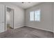Bedroom features neutral carpet, window shutters, and ceiling fan at 7072 Arabian Ridge St, Las Vegas, NV 89131