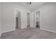 Carpeted bedroom with a view of the en-suite bathroom and closet at 7072 Arabian Ridge St, Las Vegas, NV 89131