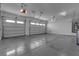 Bright three car garage with epoxy floors and overhead storage at 7072 Arabian Ridge St, Las Vegas, NV 89131