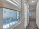 Hallway with a large window showing an enclosed patio at 7072 Arabian Ridge St, Las Vegas, NV 89131