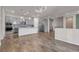 Open-concept kitchen featuring modern appliances, a kitchen island, and seamlessly connects to the living space at 7072 Arabian Ridge St, Las Vegas, NV 89131