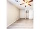 Bedroom with light walls, wood-look floors, and closet at 7371 Catmint St, Las Vegas, NV 89113