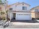 Charming two-story home with a well-maintained front yard and two car garage at 7371 Catmint St, Las Vegas, NV 89113